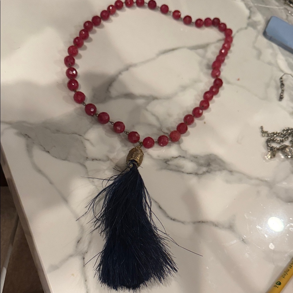 Elegant Red Beaded Necklace with Blue Tassel